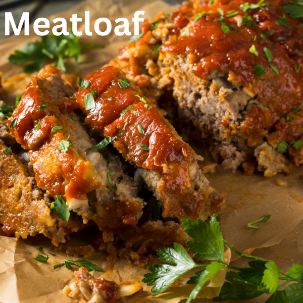 Close-up of a moist and flavorful slow-cooked meatloaf garnished with fresh parsley, served on a wooden cutting board