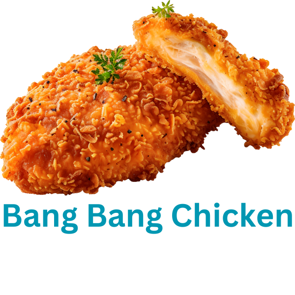 A plate of golden, crispy Bang Bang Chicken bites topped with creamy, spicy sauce and garnished with green onions.