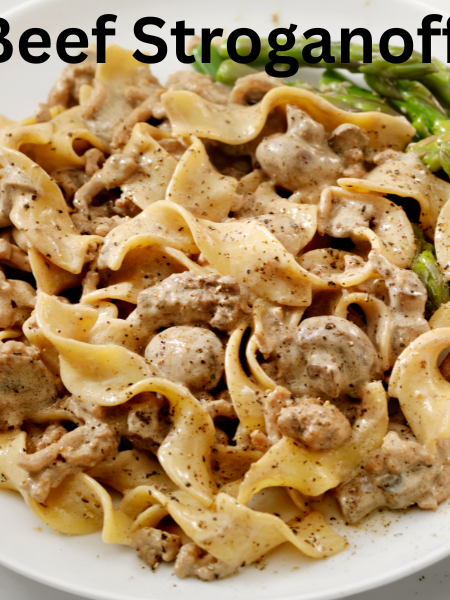 Classic beef stroganoff served with creamy sauce, tender beef strips, and mushrooms over wide egg noodles, garnished with fresh parsley