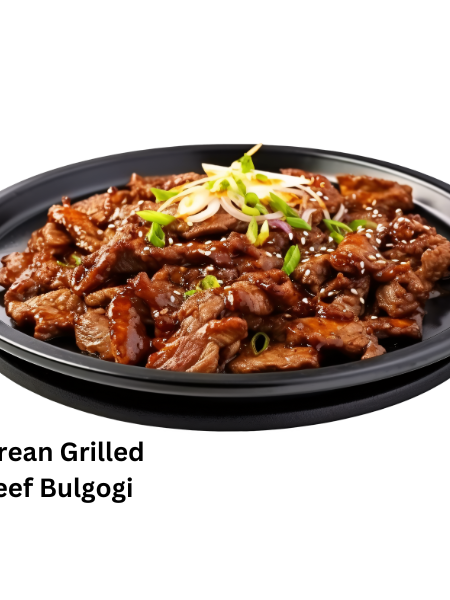 A beautifully plated Korean bulgogi dish with thinly sliced grilled beef, rice, and kimchi, garnished with sesame seeds and spring onions.