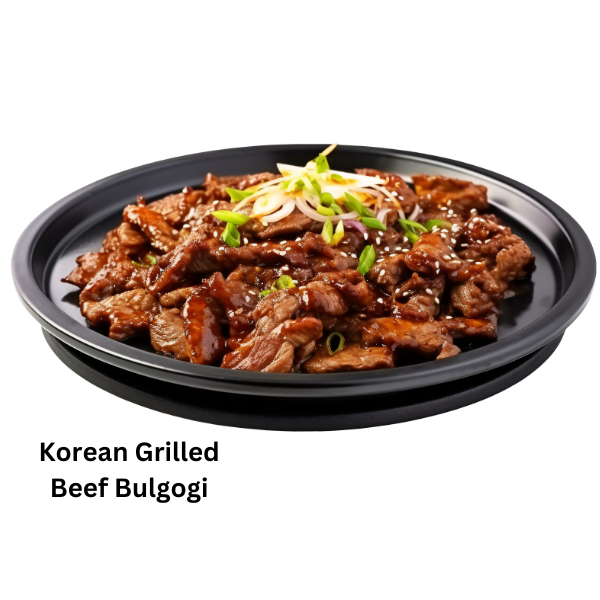 A beautifully plated Korean bulgogi dish with thinly sliced grilled beef, rice, and kimchi, garnished with sesame seeds and spring onions.