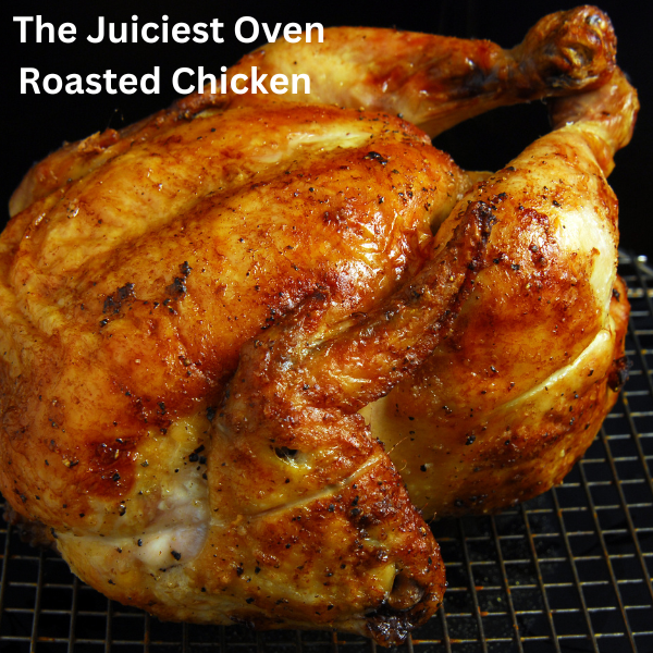 Golden brown oven-roasted chicken on a serving platter garnished with fresh rosemary and lemon slices.