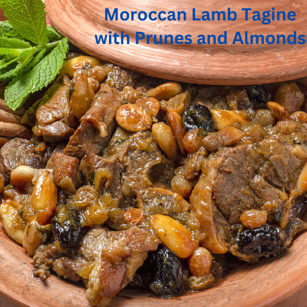 A traditional Moroccan lamb tagine with prunes and almonds, garnished with sesame seeds and served in a clay tagine dish.