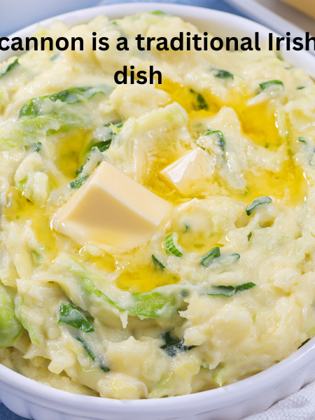 A bowl of creamy Colcannon mashed potatoes with cabbage and green onions, topped with melted butter